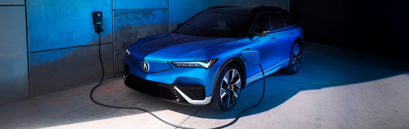 2024 Acura ZDX Type S in Double Apex Blue Pearl, 3/4 front View, Plugged In an Acura Charger