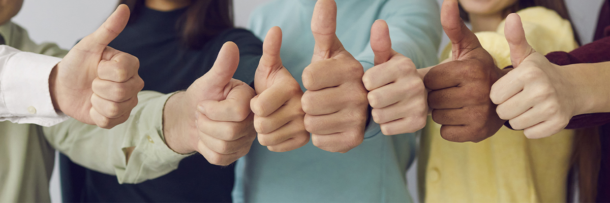 community memebers giving a thumbs up from the support