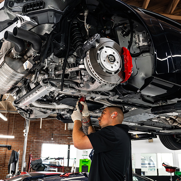 Aston Martin on lift being worked on