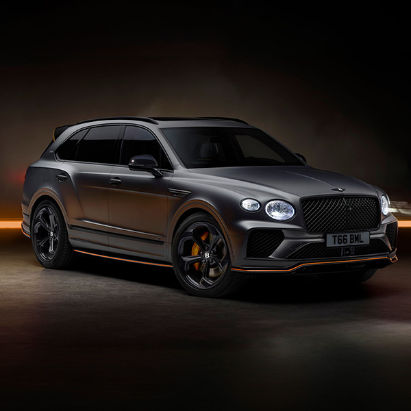 Bentley Bentayga S Black Edition front 3/4 featuring 22 inch S directional wheel - Black Painted and Polished as well as Mandarin accents on the styling kit