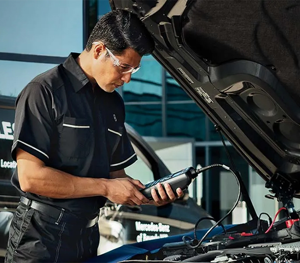 Service tech checking a battery
