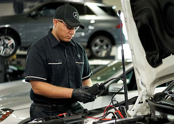 Service tech checking a battery
