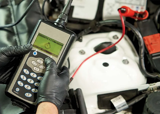 Service tech checking a battery