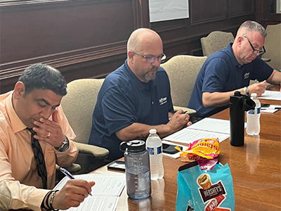 Group of people taking notes