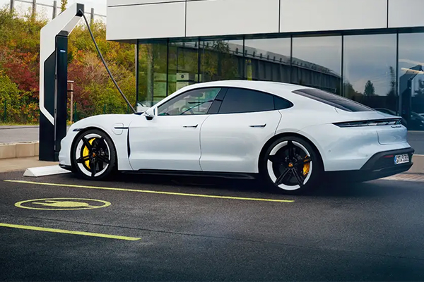 3/4 side view of a Porsche plugged up charging