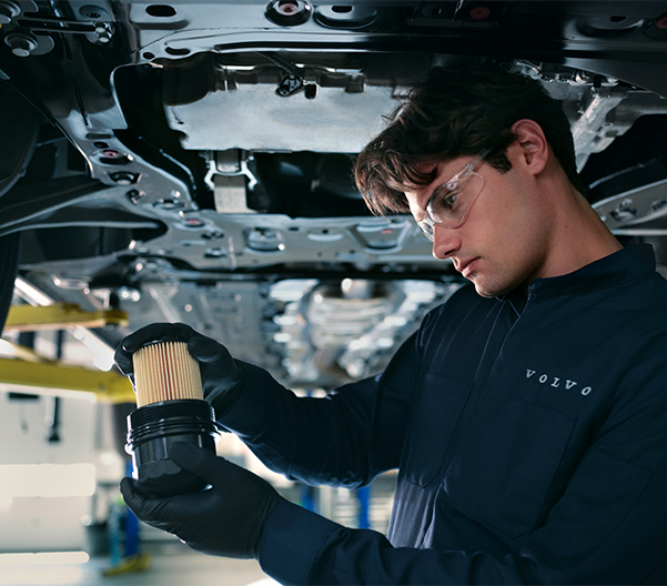 Volvo technician changing oil filter